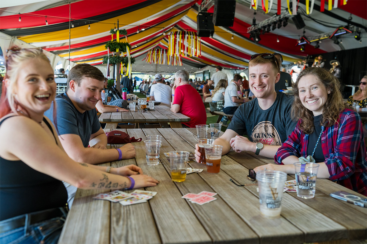 Four people at a picnic table, at Guinness Brewery