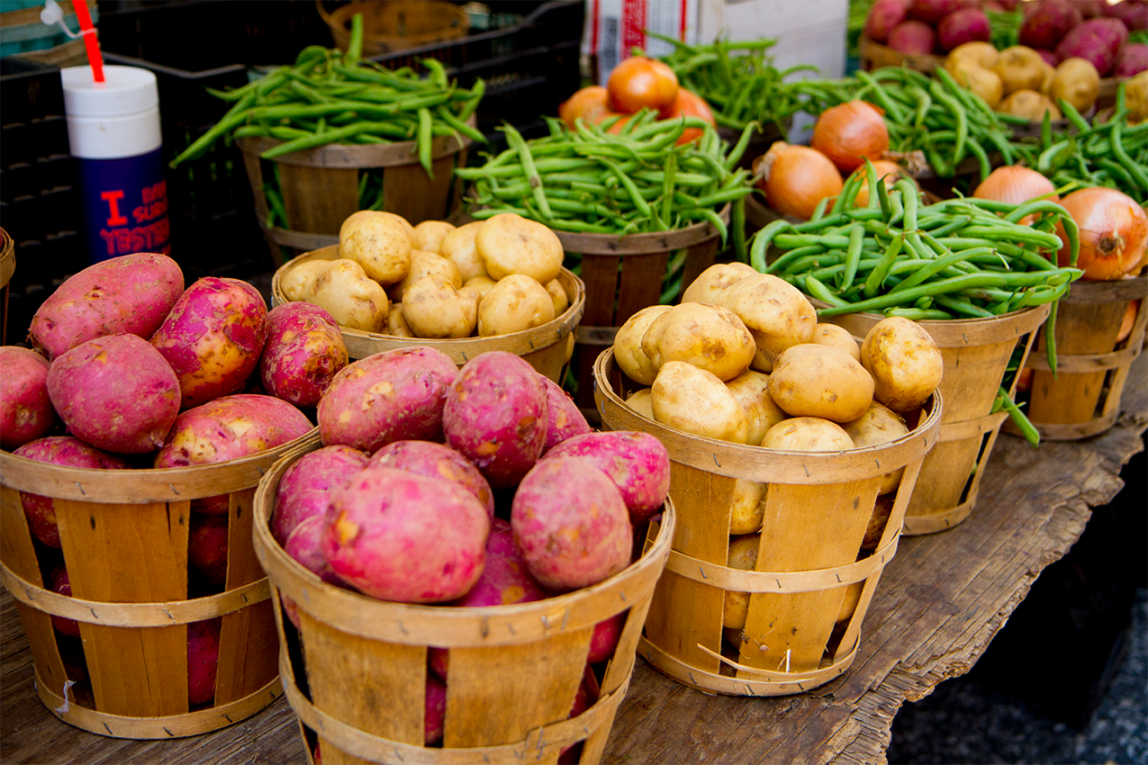 Various vegetables in baskets at a farmers market in Baltimore County.